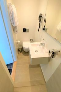 Koupelna v ubytování Hotel Skivehus