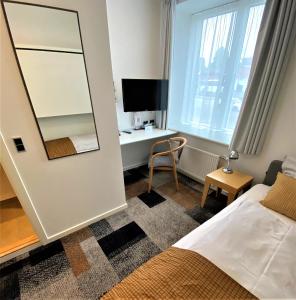 TV a/nebo společenská místnost v ubytování Hotel Skivehus
