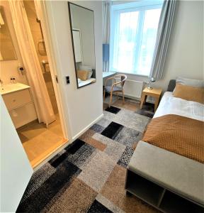 Postel nebo postele na pokoji v ubytování Hotel Skivehus