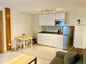 מטבח או מטבחון ב-APARTAMENTOS RURALES El Llagar de Cue