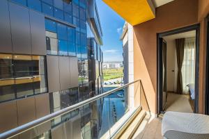 an apartment balcony with a view of a city at Elite apartments Podgorica in Podgorica