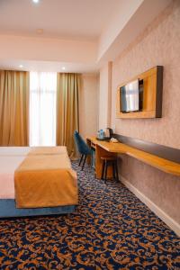 Ліжко або ліжка в номері Arion Hotel Baku