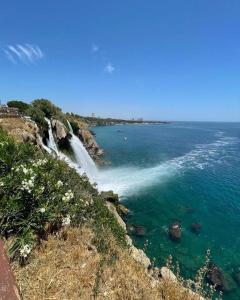 a waterfall on the side of a body of water at Düden Dream in Antalya