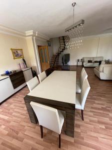 a living room with a white table and white chairs at Düden Dream in Antalya