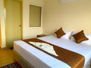 Letto o letti in una camera di Hotel Ramakrishna