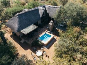 an overhead view of a house with a swimming pool at Giraffe Lodge in Hoedspruit