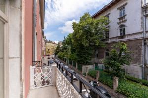 a view of a street from a balcony of a building at Hostel Antique in Pula