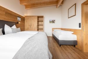 Postel nebo postele na pokoji v ubytování Apartments am Bichl + 37 fotografií