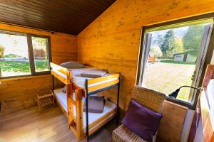 a cabin with two bunk beds and two windows at Gite le Grand Renaud in Le Bourg-dʼOisans
