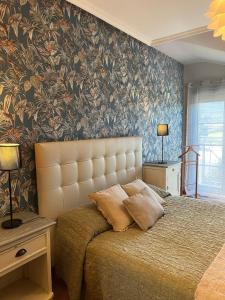 Postel nebo postele na pokoji v ubytování Costa Reinante Spa