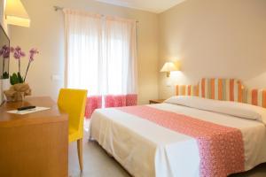 Postel nebo postele na pokoji v ubytování Blu Hotel Laconia Village