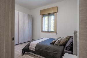 Posteľ alebo postele v izbe v ubytovaní Maneki Murri 124 bologna