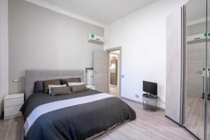 Posteľ alebo postele v izbe v ubytovaní Maneki Murri 124 bologna