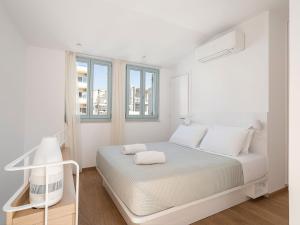 Postel nebo postele na pokoji v ubytování Mythodea Luxury Suites