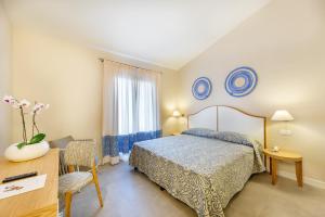 Postel nebo postele na pokoji v ubytování Blu Hotel Laconia Village