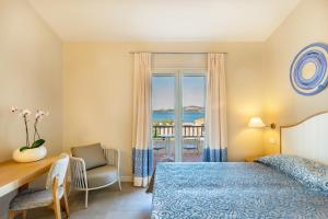 Postel nebo postele na pokoji v ubytování Blu Hotel Laconia Village