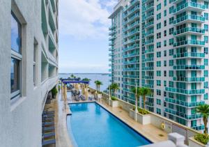 a view of a swimming pool between two buildings at Attractive 2/2 Condo In Brickell With Pool in Miami