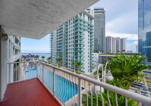 a balcony with a swimming pool and buildings at Attractive 2/2 Condo In Brickell With Pool in Miami