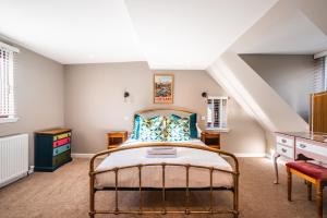 a bedroom with a bed and a staircase at Luxury Cottage with Mountain View’s in Cononbridge