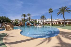 a swimming pool with a water slide in a resort at Casa Maya in Balcon del Mar