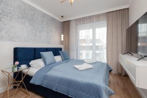 Posteľ alebo postele v izbe v ubytovaní Wyspa Solna Kołobrzeg by Renters Prestige