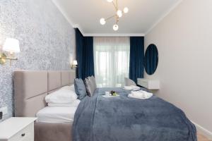 Posteľ alebo postele v izbe v ubytovaní Wyspa Solna Kołobrzeg by Renters Prestige