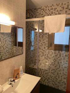 a bathroom with a sink and a shower at Nice apartment Soldeu Renttarter in Soldeu
