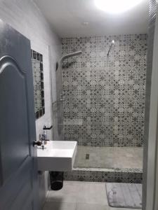 a bathroom with a sink and a shower at Unit 802 Ten South in Durban
