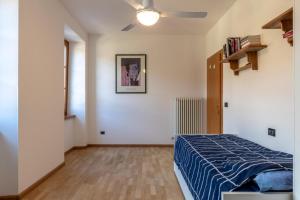 Tempat tidur dalam kamar di Casa Al Castello, Calliano Ospitar