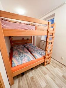 a couple of bunk beds in a room at Prokop in Železná Ruda