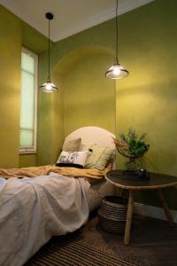Postel nebo postele na pokoji v ubytování CASA BELGERI - Bed & Breakfast