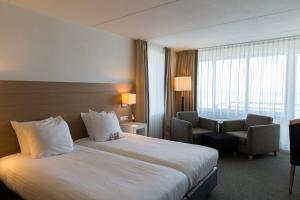 Voodi või voodid majutusasutuse WestCord Hotel Schylge toas