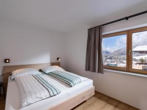 מיטה או מיטות בחדר ב-Haus Seisl