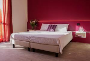 La Castellana B&B tesisinde bir odada yatak veya yataklar