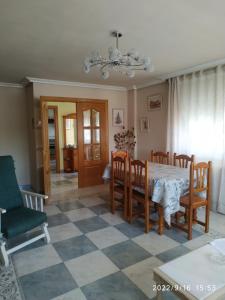 a dining room with a table and chairs at Miradoralaribera Chalet rural in Alcoba de la Ribera