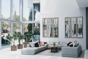 a living room with two couches and a table at Iberostar Selection Lagos Algarve in Lagos