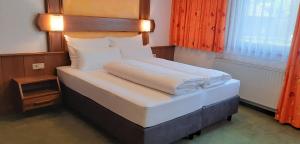 Postel nebo postele na pokoji v ubytování Hotel Garni Belvedere