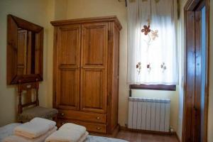 Posteľ alebo postele v izbe v ubytovaní El Nido de Gredos cuco apartamento con chimenea