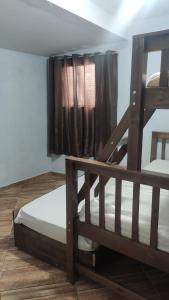 a bedroom with two bunk beds and a window at Incrivel chacara com pisc e churrasq em Extrema MG in Extrema