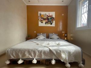 Postel nebo postele na pokoji v ubytování Fleur de cactus, Guesthouse, Tamraght