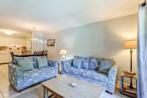 a living room with two blue couches and a table at HH Beach & Tennis 7A in Hilton Head Island