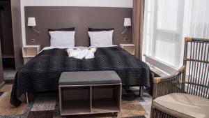Postel nebo postele na pokoji v ubytování Hotel Skivehus