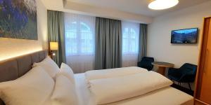 Postel nebo postele na pokoji v ubytování Hotel Garni Belvedere