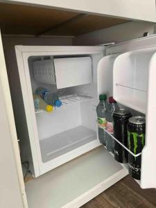 an empty refrigerator with its door open and drinks inside at Monteurzimmer bei EnergyFreund in Knetzgau
