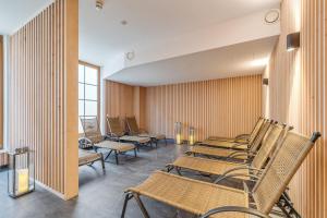 a row of chairs in a waiting room at Steinadler Monte - Skiing Holiday in Obertauern in Obertauern