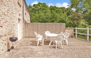 a patio with a table and chairs and a grill at Lovely Home In Vaudoy-En-Brie With Wifi in Vaudoy-en-Brie
