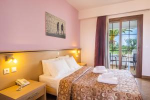 Postel nebo postele na pokoji v ubytování Irini Hotel