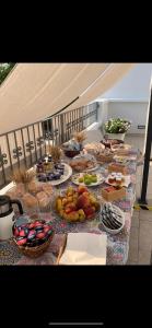 a long table with plates of food on it at AL VECCHIO FRANTOIO in Manduria