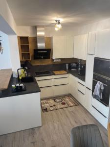 a kitchen with white cabinets and a counter top at Premium Home 23 in Vienna +18 photos