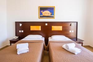 Postel nebo postele na pokoji v ubytování Irini Hotel